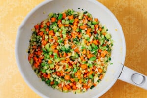 Sautéing veggies in a pan.