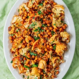 Garlic parmesan cauliflower and chickpeas on a platter.