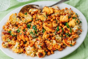 Garlic parmesan cauliflower and chickpeas on a platter.