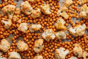 Garlic parmesan cauliflower and chickpeas on a baking sheet..