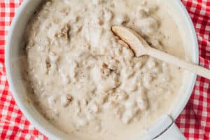 Vegan sausage gravy with a spoon.