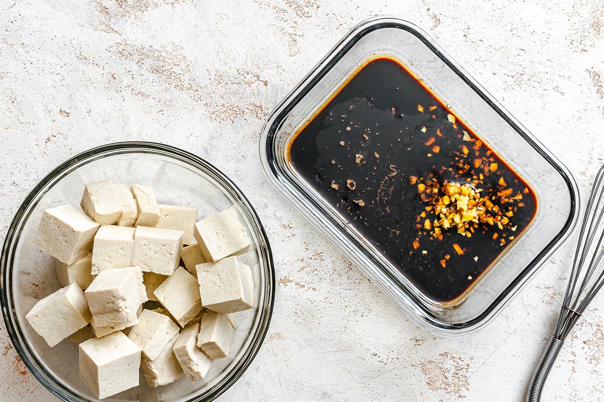 A bowl of tofu and a marinade.